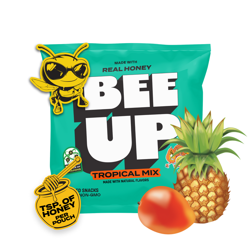 A teal pouch of "Tropical Mix" BEEUP honey fruit snacks surrounded by a pineapple, mango, passionfruit, papaya, and a honey jar & dipper sticker